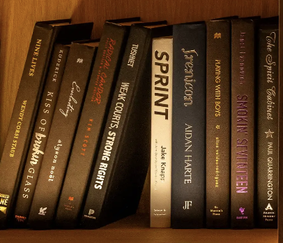 A photograph of ten books from the OpenAI library