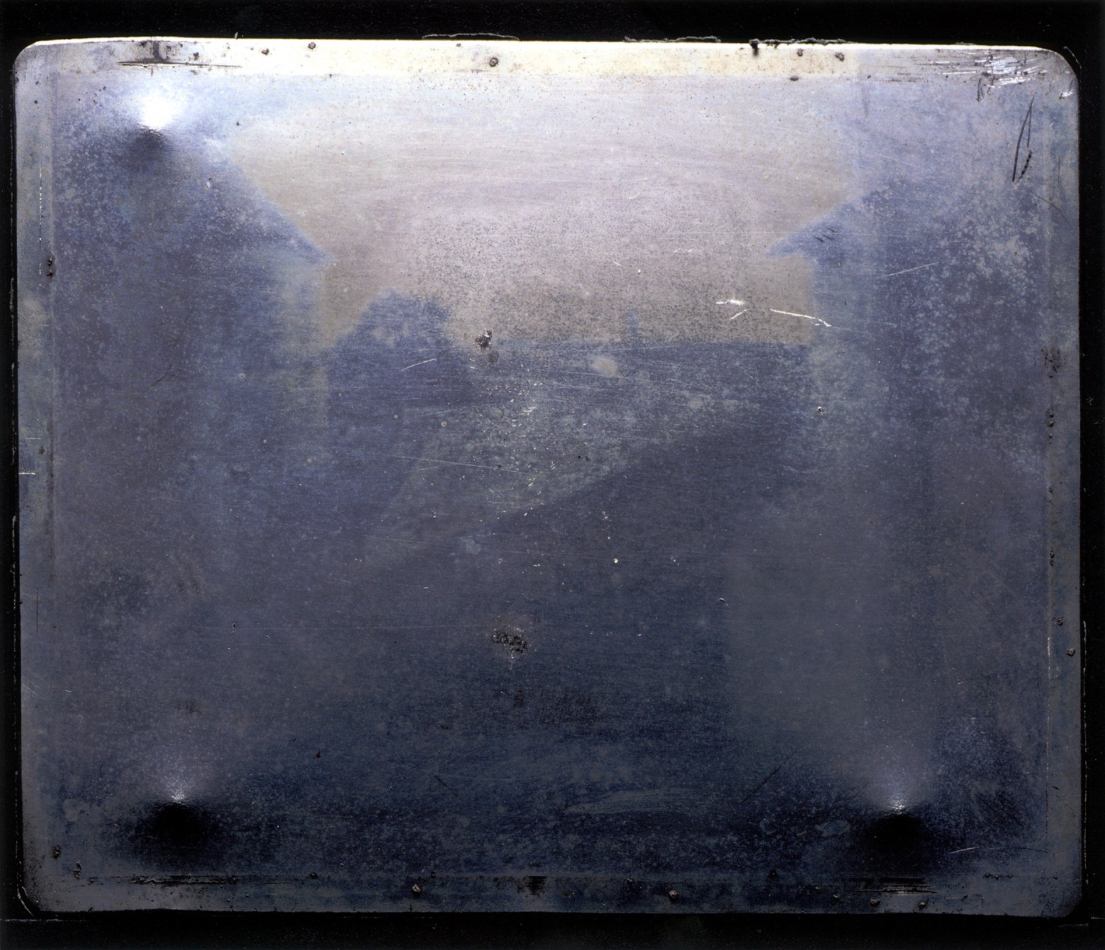 The original plate of “View from the Window at Le Gras”, a heliograph made by Nicéphore Niépce around 1827.